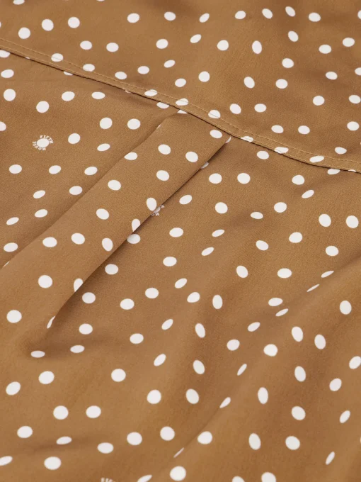 Blouse met stippen en strikkoord
