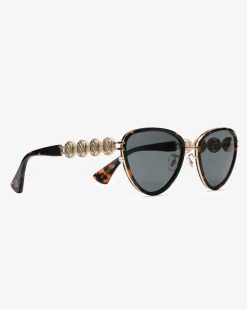 Vlindervormige zonnebril met goudkleurige details