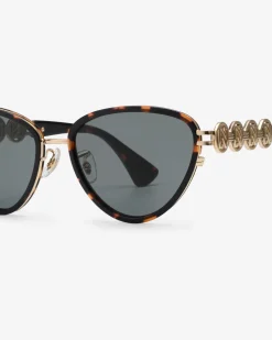 Vlindervormige zonnebril met goudkleurige details