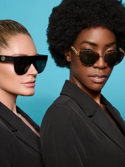 Vlindervormige zonnebril met goudkleurige details