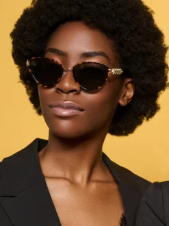 Vlindervormige zonnebril met goudkleurige details